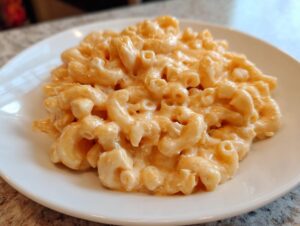 Close-up of creamy, cheesy elbow macaroni noodles in a serving of cottage cheese mac and cheese.